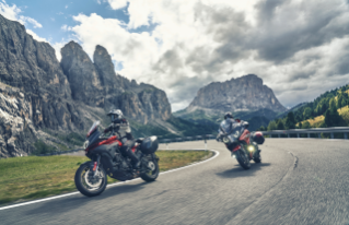 motorcycles driving through the mountains