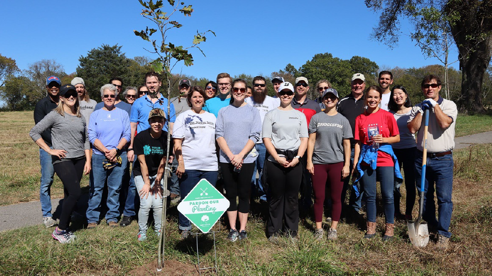 bridgestone employees planting trees