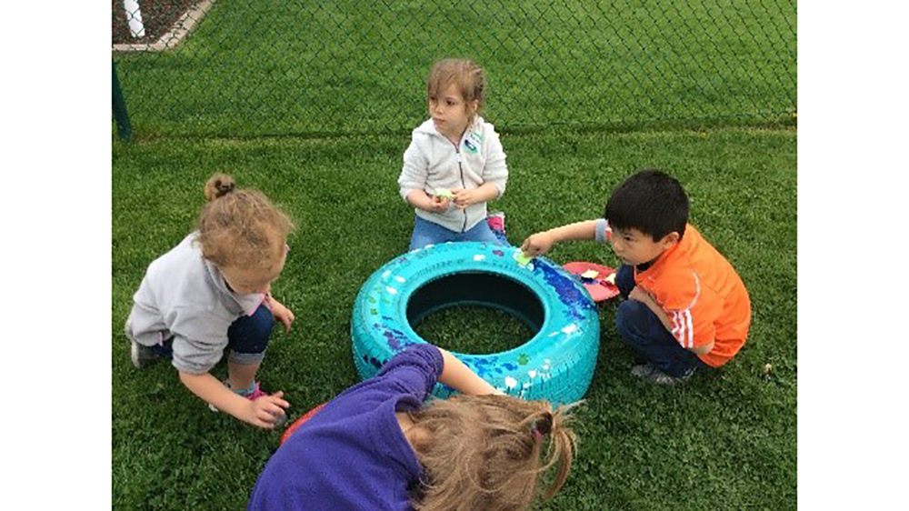 Firestone Complete Auto Care (FCAC) store donates tire planters to local preschool playground