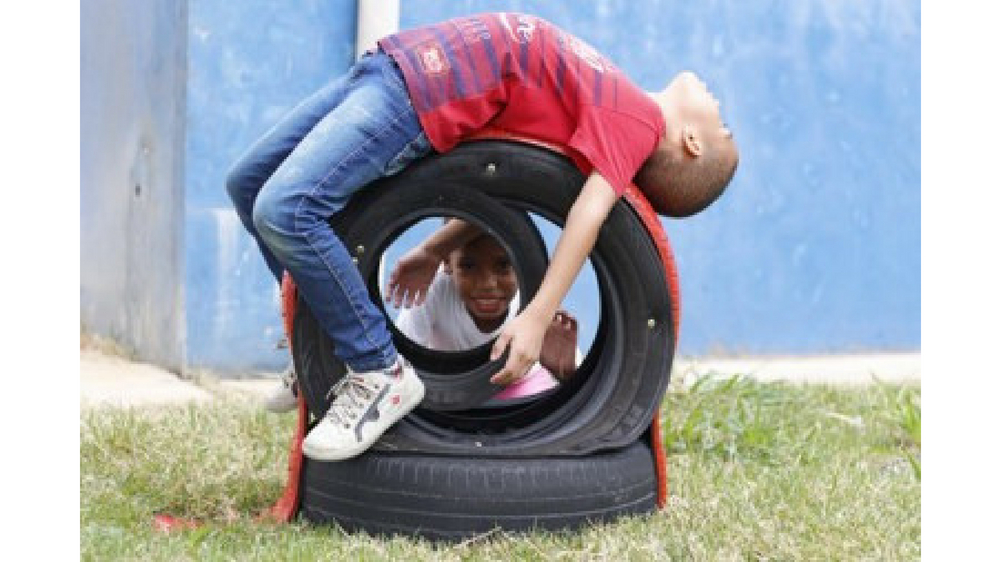 Children playing at Bridgestone Environmental Education Project in Brazil