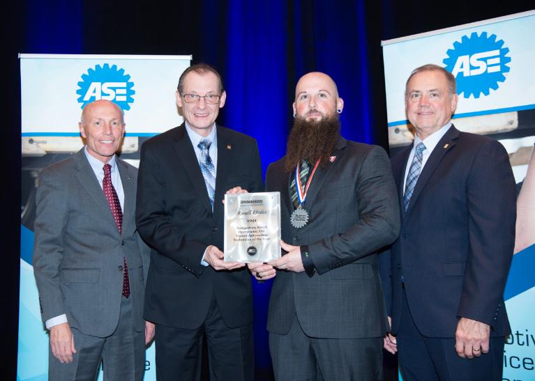 Firestone Complete Auto Care lead technician Russell Rhodes receives 2021 ASE Master Technician of the Year award