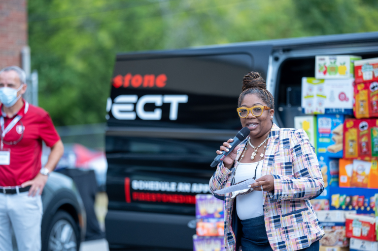 Sonya Brooks, Principal of Maplewood High School, welcomes the students and guests to Friday’s event at the Auto Training Center