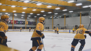 Nashville Predators Youth Hockey players in jerseys on ice