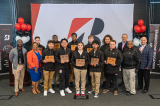 Maplewood High School Automotive students pose with Bridgestone leaders and Maplewood staff