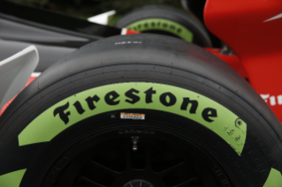 Close-up of Firestone Firehawk logo on the tire's sidewall