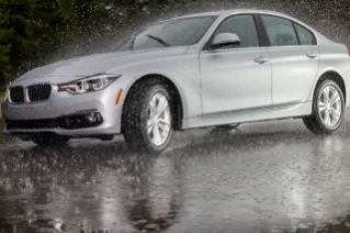 DriveGuard Plus tires on a sedan in the rain