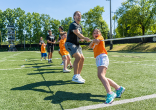 Tight End University participants and Boys & Girls Club youth from Middle Tennessee work hard in a game of tug of war.