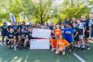 Bridgestone and Tight Ends along with Boys & Girls Club representatives and local kids celebrate $681,000 in donations to clubs across the country.