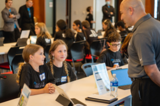 Code Academy Participants Demonstrate App Design to Marko Ibrahim