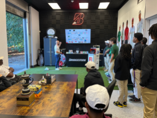 Drew Charter golf team members listen to Bridgestone Golf presentation by Adam Rehberg, Bridgestone Golf Marketing