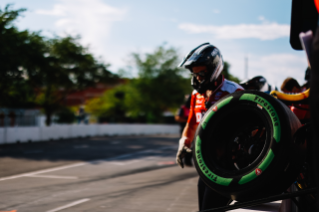 Pit Crew Member with Guayule tire