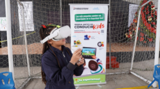 Children use virtual reality to learn road safety in Bridgestone's "Think Before You Drive" kids program in Latin America communities.