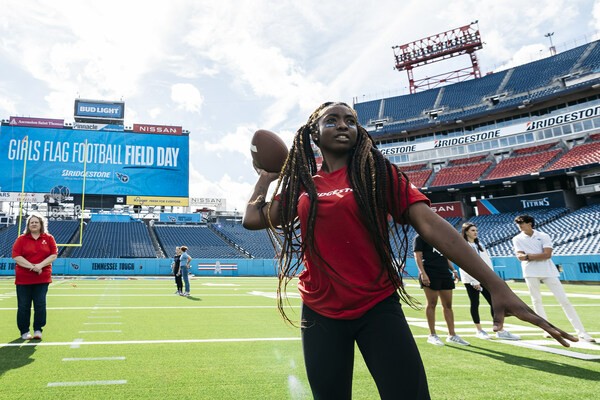 Girls playing flag football at the Tennessee Titans stadium